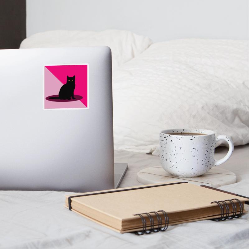 Black cat on a pink background